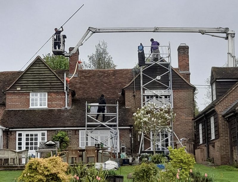 The Roof Moss Cleaners using cherry picker and scaffolding to clean roof safely and professionally in Cookham, Berkshire