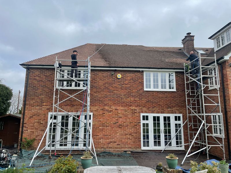 Roof cleaning carried out safely from scaffold towers by The Roof Moss Cleaners in Cookham